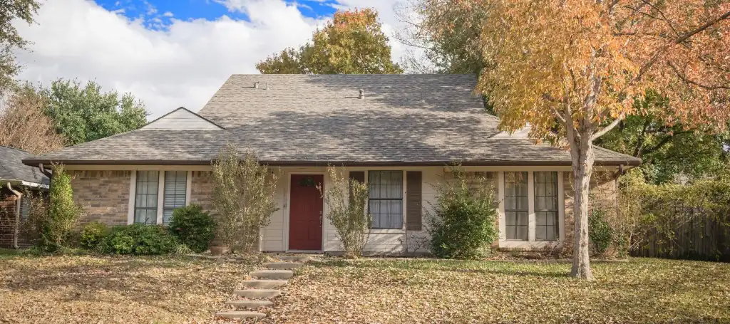 Houston ranch home with a red front door